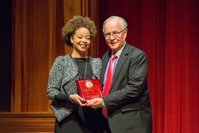 2018 Faculty Recipient Joedreka Brown Speights presents the 2019 Dr. Martin Luther King, Jr. Distinguished Service Award to this year's faculty winner, mediator Donald J. Weidner.