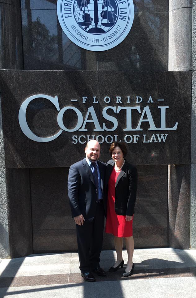 Lawrence Kolin and A. Michelle Jernigan pose in front of Florida Coastal School of Law