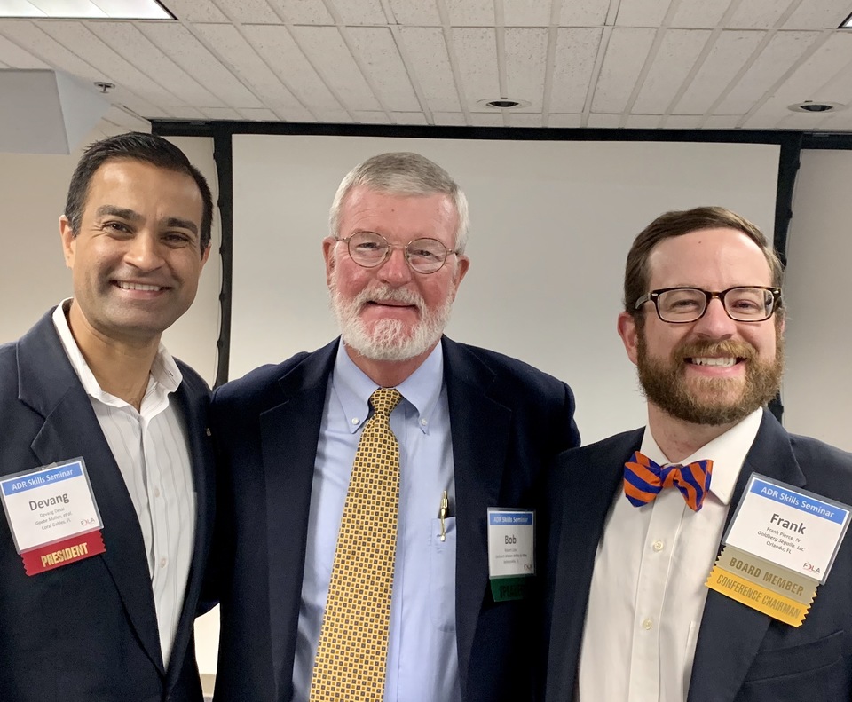 Mediator Robert A. "Bob" Cole takes a moment at the FDLA ADR Skill Seminar in Longwood for a photo with FDLA President Devang Desai, left, and seminar organizer Frank Pierce.emin