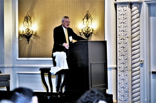 Mediator Bob Cole makes opening remarks for the awards banquet.