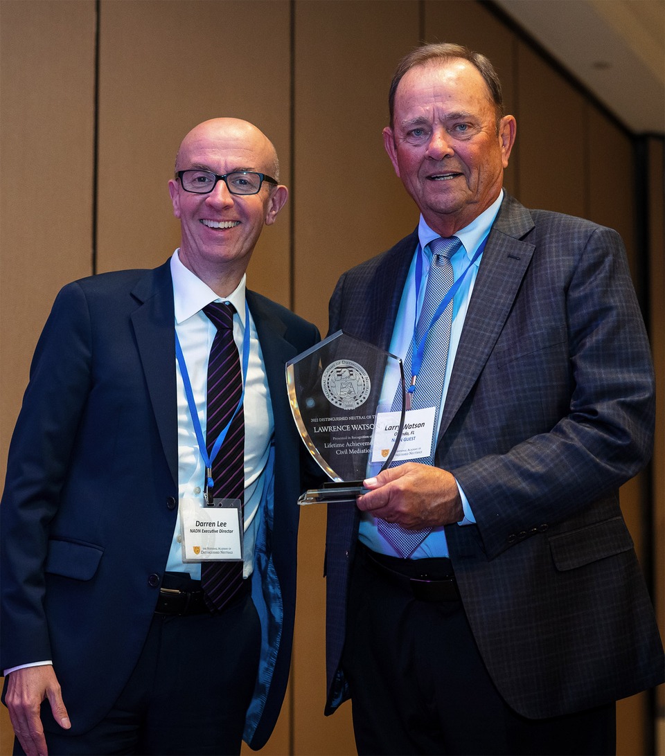 Larry Watson, right, is presented his Lifetime Achievement Award by NADN's Executive Director, Darren Lee.