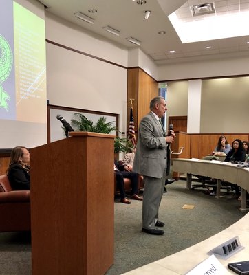 Florida Mediator Carl Schwait awards scholarship and discusses a Florida Bar mental health and wellness initiative. His presentation was part of an April 10 event at The University of Florida Levin College of Law. Photo by Ren�e Thompson.