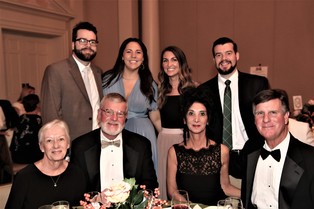 Bob's wife, Kathy, front left; brother Frank Cole and his wife, Andrea, front right; and Bob's sons and their wives -- Brett and Emma Cole and Vicky and Blake Cole, back, from left -- were on hand for the presentation.