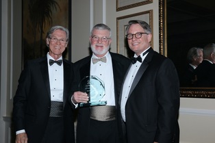 Wayne Hogan, from left, recipient Bob Cole, and ABOTA local chapter President Curry Pajcic of Pajcic & Pajcic pose with the award.