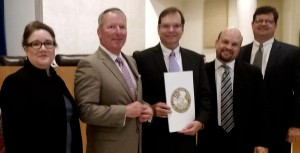 Principal Kimberly Sands, Orlando Mayor Buddy Dyer (from left), Shareholder Richard Lord and mediators Lawrence Kolin and Brandon Peters pose after the official reading and presentation of the proclamation by the City of Orlando. 